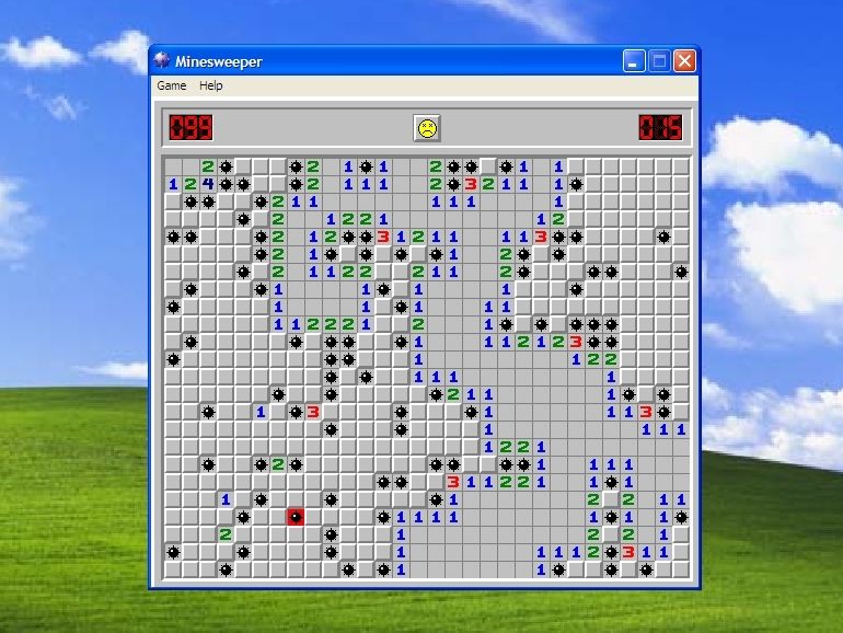Minesweeper trên nền WinXP cũ.